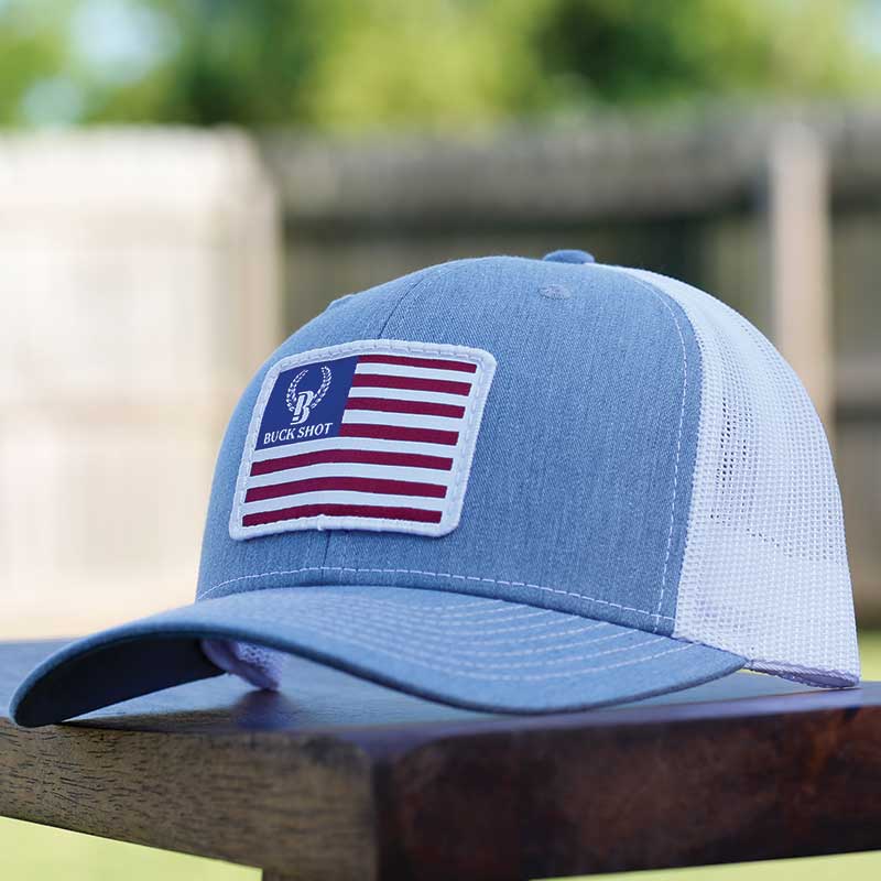 A blue hat with an american flag patch on it.