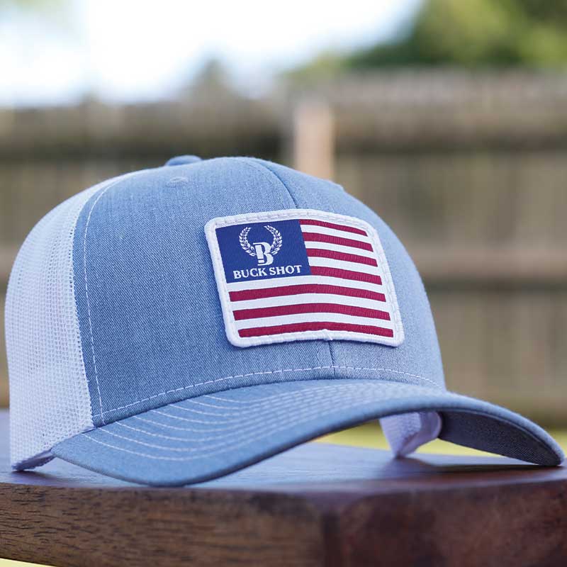 A blue hat with an american flag patch on it.