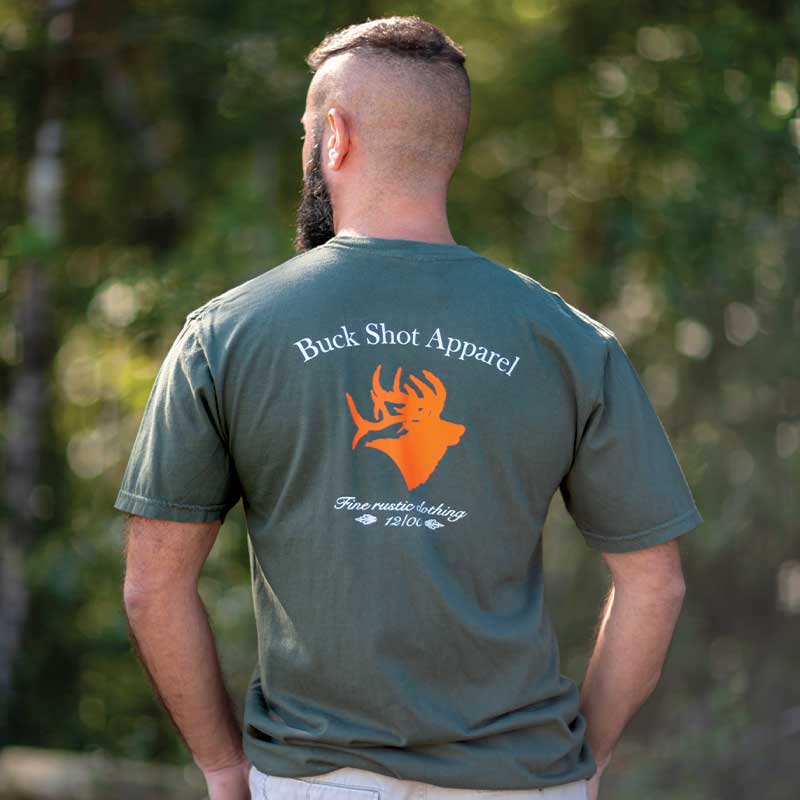 A man with a mohawk is wearing a t-shirt.