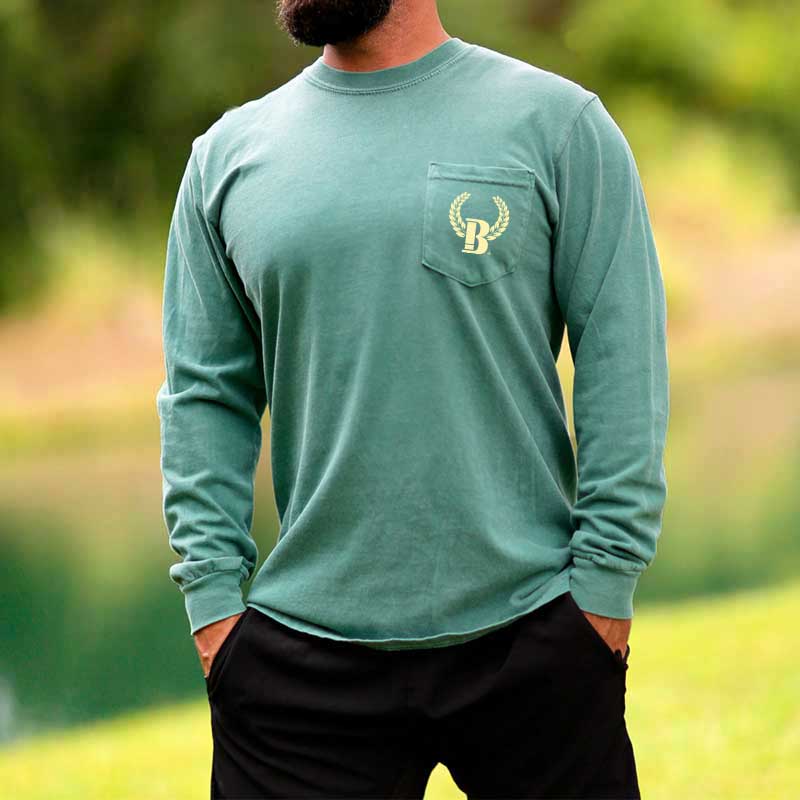 A man with a beard wearing a green shirt