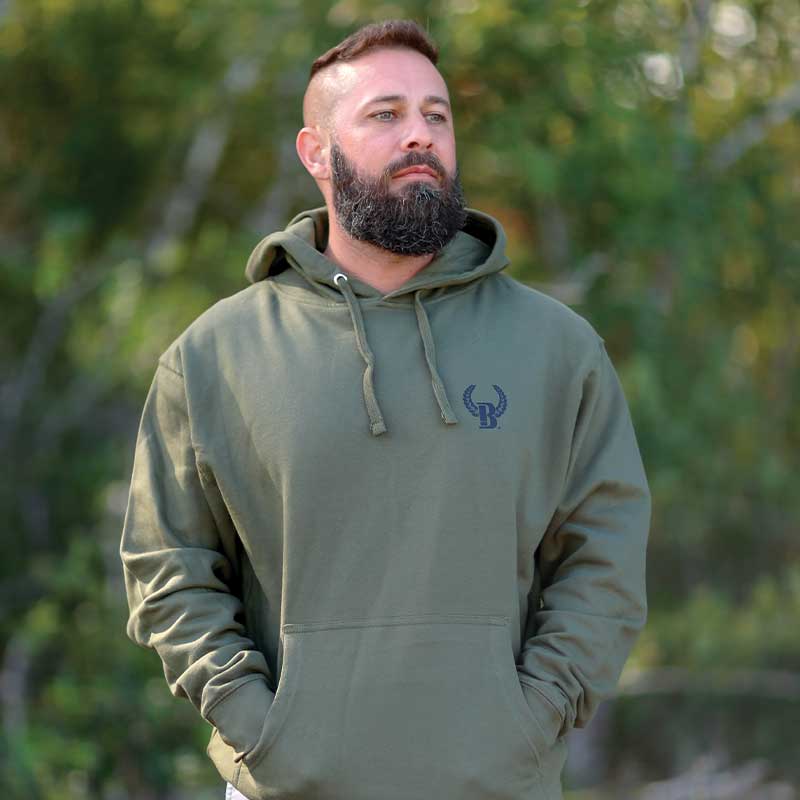 A man with a beard and a green hoodie