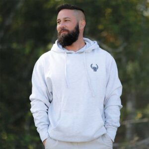 A man with a beard and a white hoodie