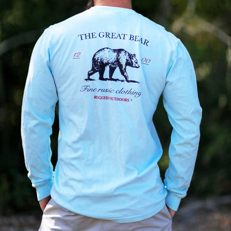 A man wearing a long sleeve shirt with an image of a bear on it.