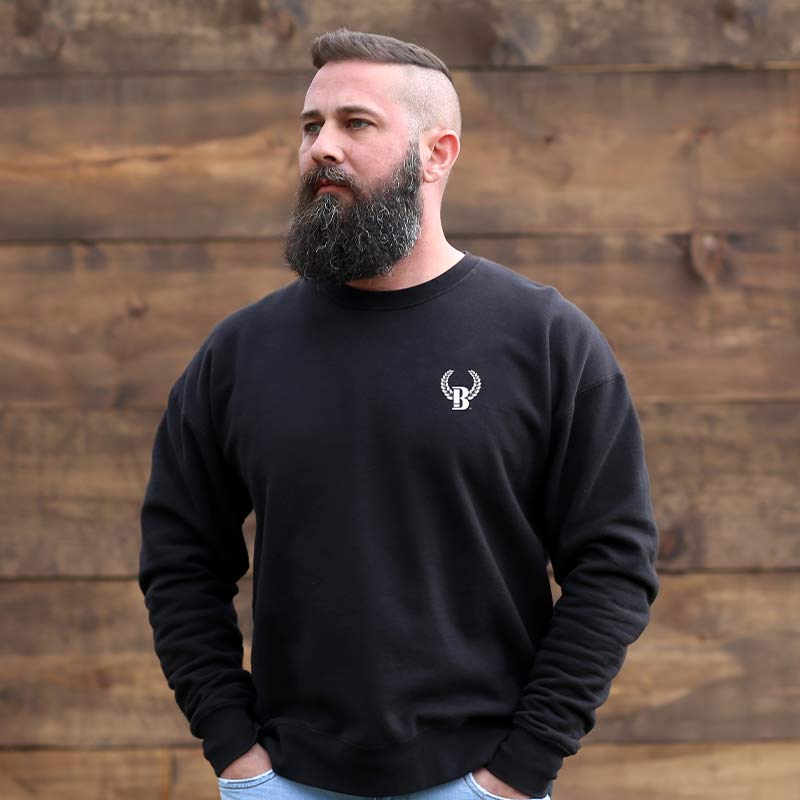 A man with a beard and a black sweatshirt