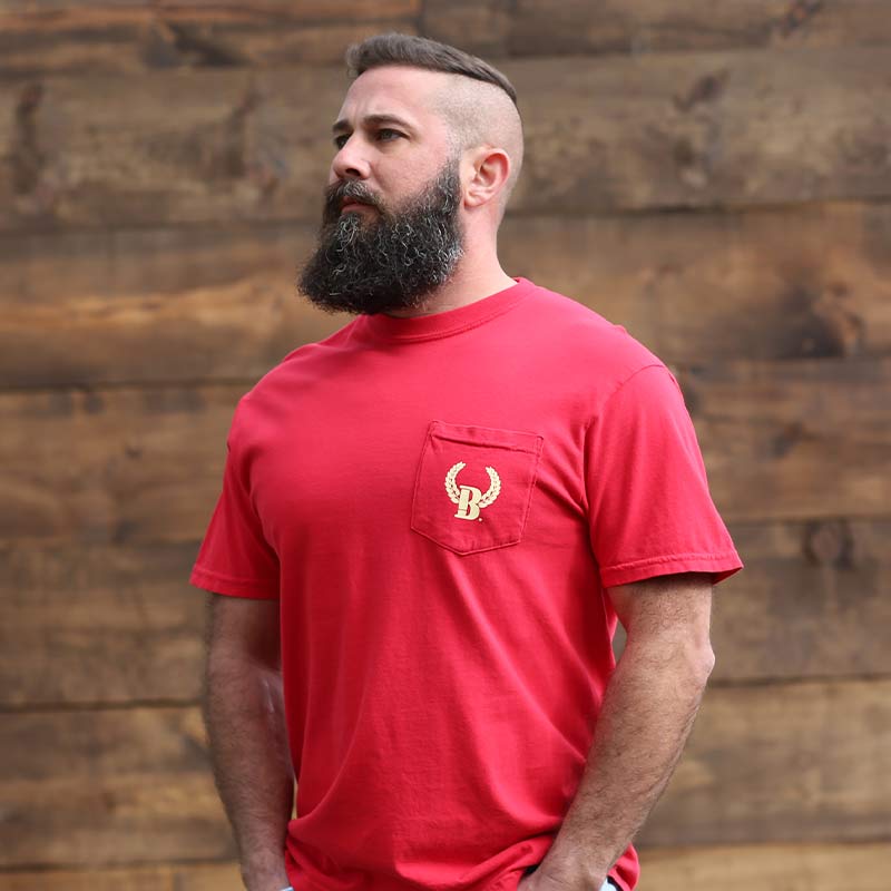 A man with a beard and a red shirt