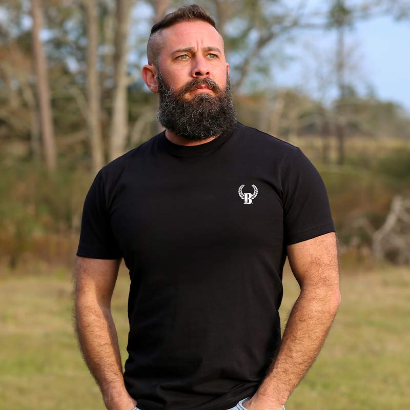 A man with beard and mustache wearing black shirt