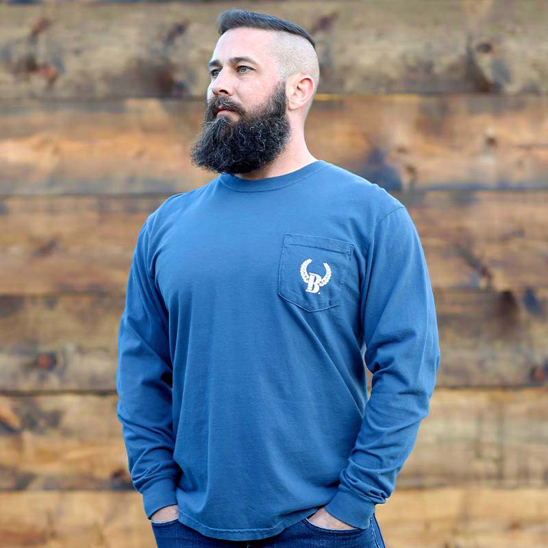 A man with a beard and a blue shirt