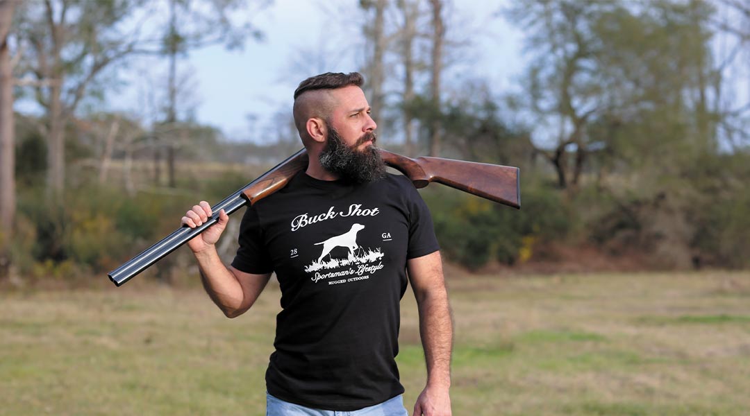 A man with a beard and a gun