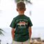 Youth wearing a short sleeve dark emerald colored t-shirt with a Redfish graphic