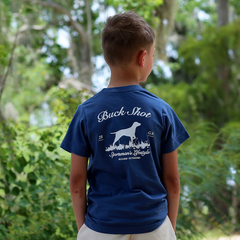 youth-pointer back Youth wearing navy t-shirt featuring a white silhouette of a Pointer dog in the grass